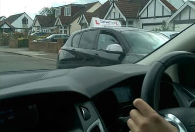 View from the driver’s seat of a DriveThruL car on a residential street