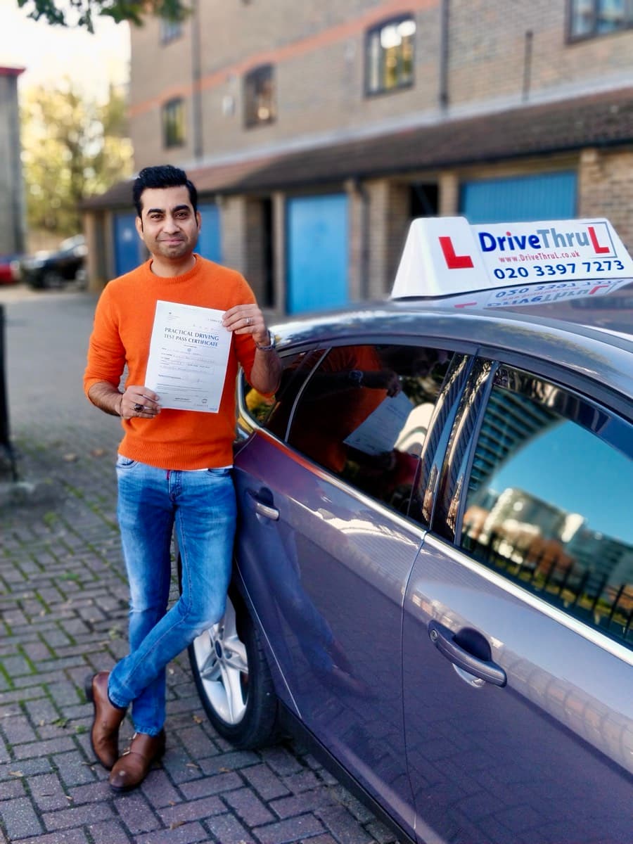 Student with instructor holding pass certificate in Docklands