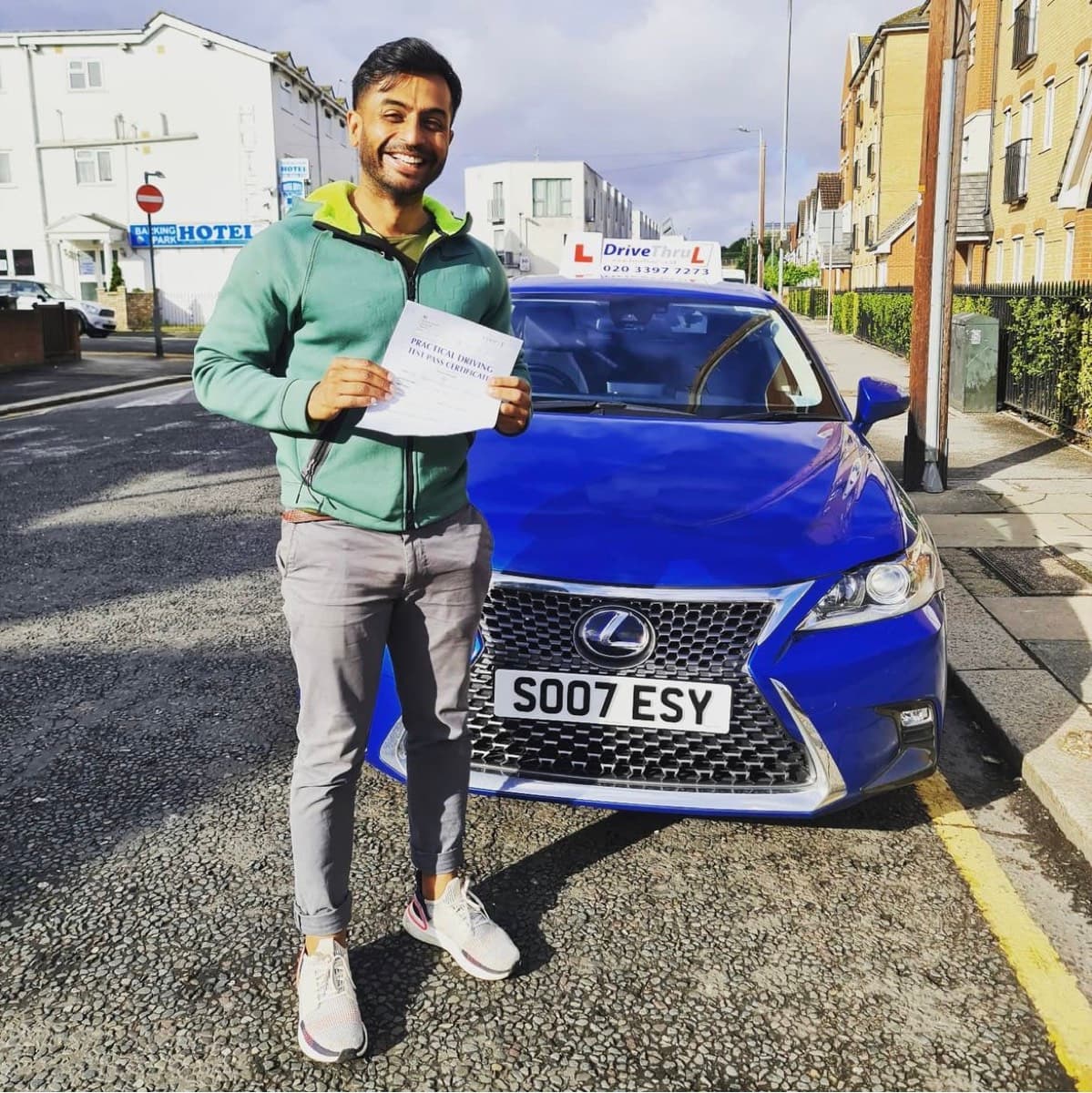 Student with pass certificate near Canary Wharf